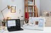 Brother Innov-is NS1850D embroidery machine with touchscreen and laptop displaying Disney designs