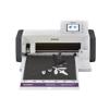 Brother ScanNCut DX cutting machine with touchscreen display cutting floral design on black mat