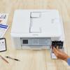 Brother MFCJ4345DW all-in-one color inkjet printer with hand replacing ink cartridges