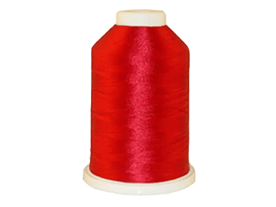Brother red embroidery thread spool on white background