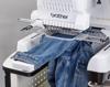 Brother PR1060W embroidery machine with tubular frame stitching denim jacket
