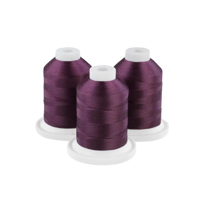 Brother embroidery thread spools in deep maroon with white caps