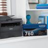 Brother all-in-one laser printer with TN760 toner cartridge on home office shelf