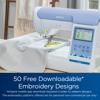 Brother PE900 embroidery machine with touchscreen stitching yellow flower design on white fabric