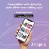 Hand holding smartphone displaying Brother Artspira all-in-one crafting app with embroidery designs