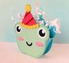 Colorful paper craft dinosaur with party hat and tissue paper frills
