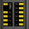 Etiquetas laminadas Brother en panel eléctrico identificando habitaciones en amarillo y negro