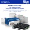 Brother DR229CL genuine drum unit with packaging and stacks of printed documents