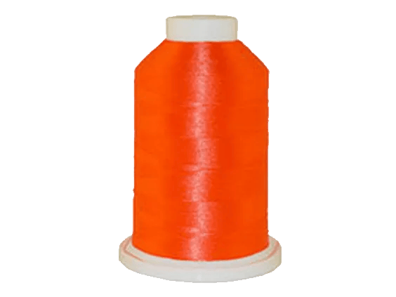 Bright orange embroidery thread spool on white background