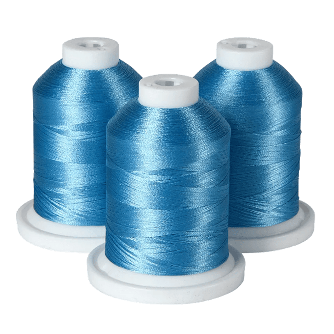 Three blue embroidery thread spools on white bases for Brother sewing machines