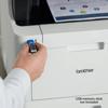 Hand inserting USB drive into Brother color laser all-in-one printer for direct printing