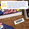 Brother DK-1204 barcode label on wooden desk with label printer and craft supplies