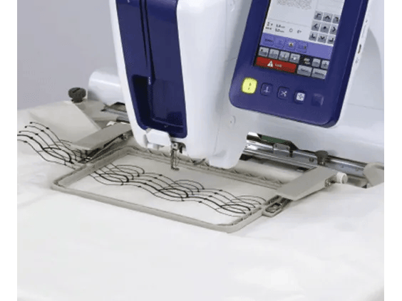Brother PRSTH200 embroidery machine stitching decorative pattern on fabric in hoop