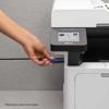 Hand inserting USB drive into Brother MFC-L5710DN all-in-one laser printer touchscreen panel