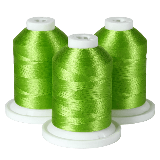 Three green embroidery thread spools on white bases for Brother sewing machines