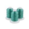 Three spools of blue-green embroidery thread on white bases