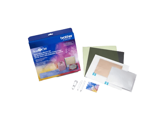 Brother ScanNCut starter kit with cutting mats, tools, and instructional materials