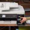 Brother MFC-J6540DW all-in-one inkjet printer with hand replacing color ink cartridges