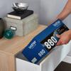 Person placing Brother TN880 high-yield toner cartridge in home office drawer