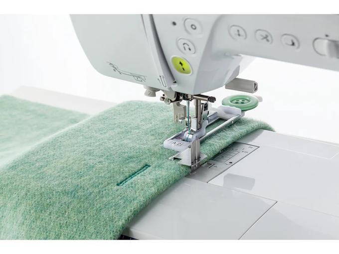 Brother sewing machine stitching green felt fabric with button attachment foot