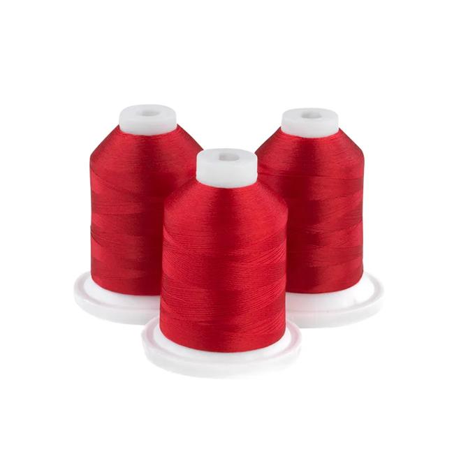 Three red embroidery thread spools on white bases