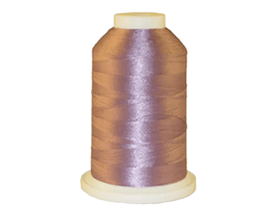 Brother embroidery thread spool in metallic purple with glossy finish on white background