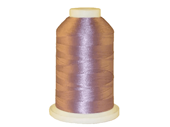 Brother embroidery thread spool in metallic purple with glossy finish on white background