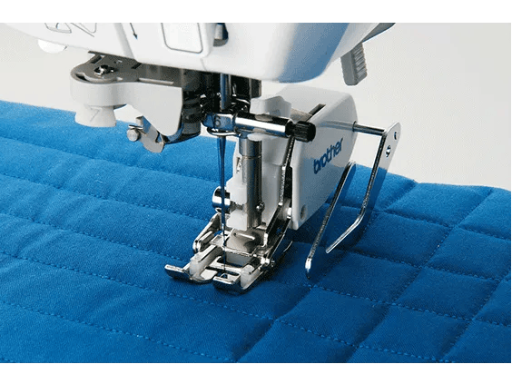 Brother sewing machine presser foot quilting blue fabric with diamond pattern