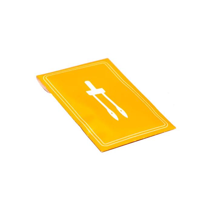 Yellow cutting mat with white grid lines and measurement guides