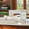 Brother Stellaire XE2 embroidery machine with touchscreen displaying floral design on fabric