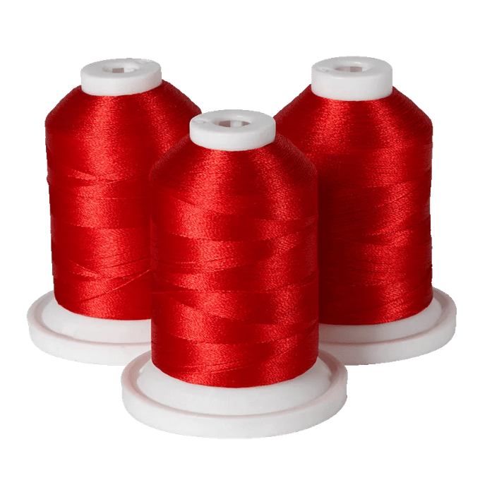 Three spools of red embroidery thread on white bases for Brother sewing machines
