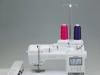 Brother sewing and embroidery machine with dual thread spools in pink and purple