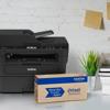 Brother MFC-L2750DW all-in-one laser printer with Refresh toner subscription box on desk