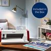 Brother ScanNCut cutting machine on desk with crafting materials and accessories included in box