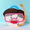 Decorative paper craft character wearing pink diving mask and orange snorkel on blue background