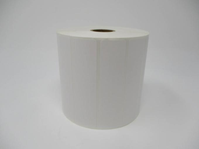 Brother white die-cut label roll with rounded corners on neutral background
