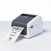 Brother TD-4D label printer printing barcode label on white surface