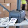 Brother thermal label printer printing barcode labels in warehouse setting