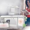 Woman using tablet near Brother Luminaire innovis XP2 embroidery machine with touchscreen display