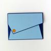 Blue striped envelope-style folder with navy trim and orange snap closure