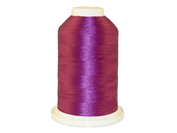 Brother embroidery thread spool in vibrant purple with white cap on transparent background