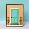 Green door with white frame and decorative heart-shaped topiaries in terracotta pots