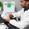 Medical professional operating Brother handheld label maker at organized workspace with file folders