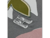 Brother sewing machine presser foot on fabric with decorative stitching detail