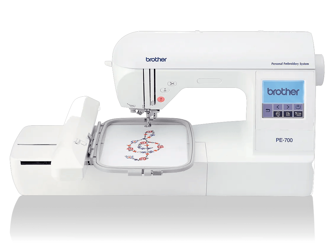 Brother PE-700 embroidery machine with touchscreen and floral design in hoop