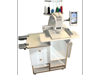 Brother embroidery machine with touchscreen on custom table with storage drawers