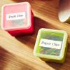 Brother TZe label tape organizing push pins and paper clips in labeled storage containers