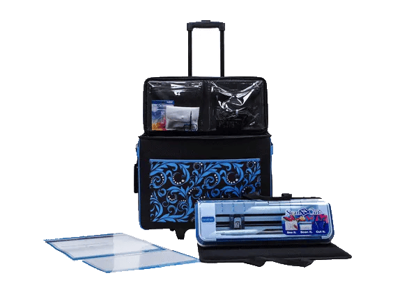 Brother cutting machine with blue patterned tote bag and crafting accessories