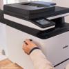 Hand opening paper tray on Brother MFC-L8730CDW all-in-one color laser printer