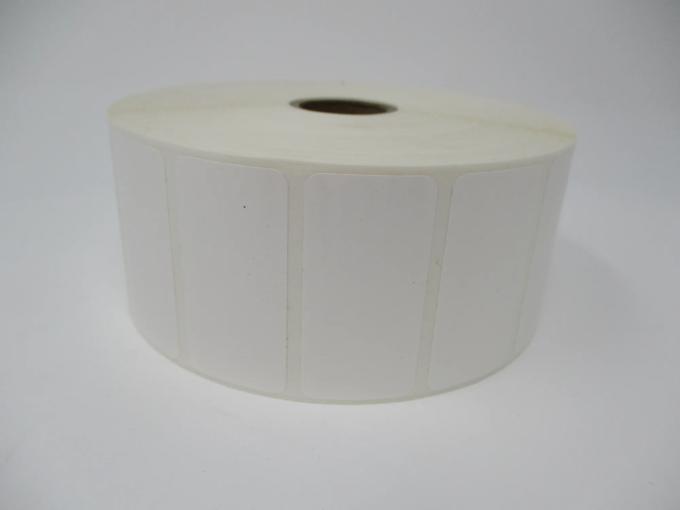 Roll of white rectangular Brother thermal labels on cardboard core